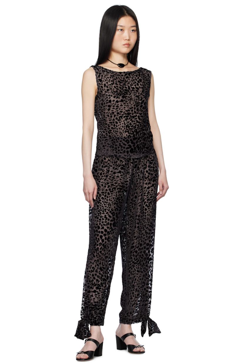 Semi-sheer viscose- and silk-blend chiffon trousers. Leopard pattern flocked throughout.

· Elasticized waistband
· Bow accent and press-stud fastening at cuffs

Supplier color: Brown Black