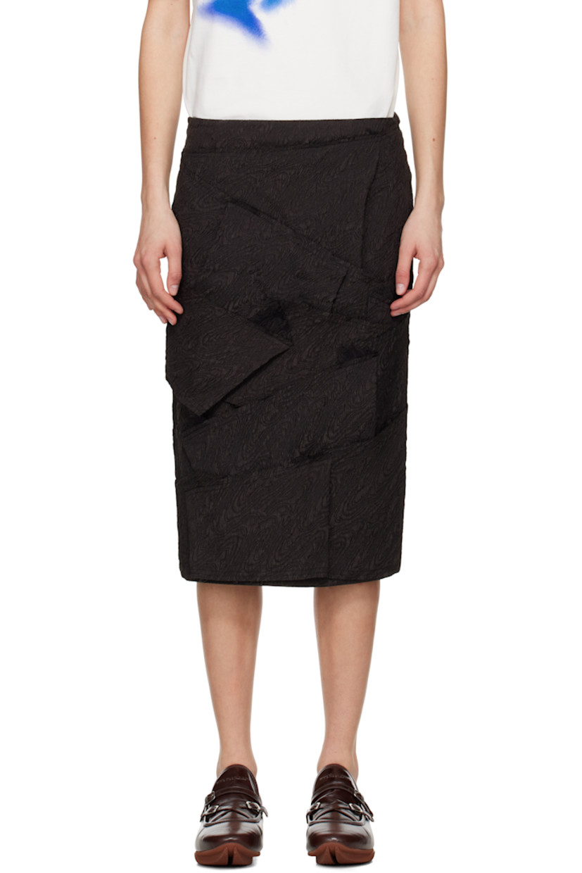 Polyester cloqué midi skirt. Raw edges throughout.

· Paneled construction
· Zip closure at side seam
· Frayed logo flag at back waist
· Full satin lining

Supplier color: Black
