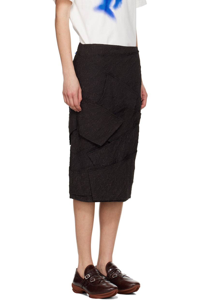 Polyester cloqué midi skirt. Raw edges throughout.

· Paneled construction
· Zip closure at side seam
· Frayed logo flag at back waist
· Full satin lining

Supplier color: Black