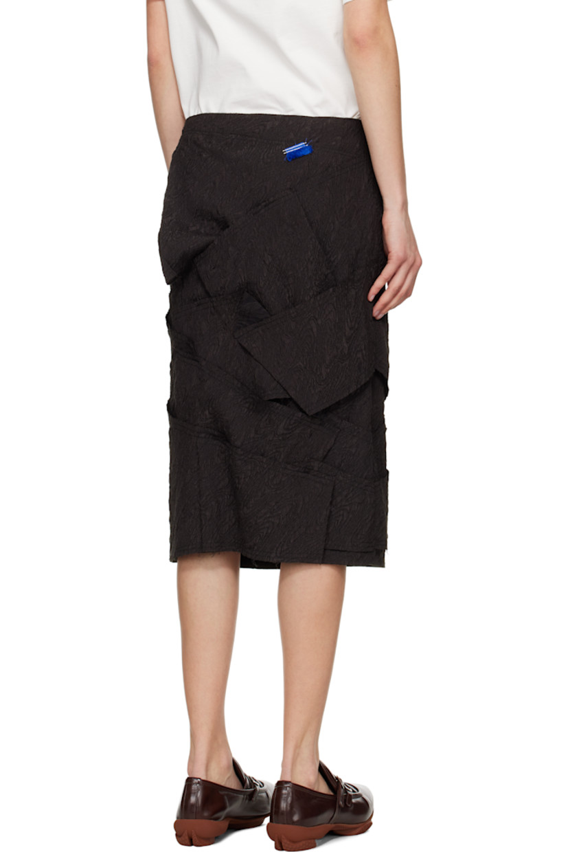 Polyester cloqué midi skirt. Raw edges throughout.

· Paneled construction
· Zip closure at side seam
· Frayed logo flag at back waist
· Full satin lining

Supplier color: Black