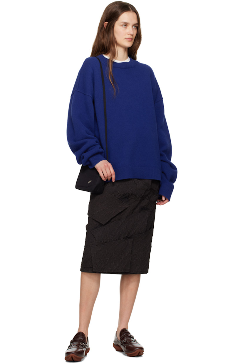 Polyester cloqué midi skirt. Raw edges throughout.

· Paneled construction
· Zip closure at side seam
· Frayed logo flag at back waist
· Full satin lining

Supplier color: Black