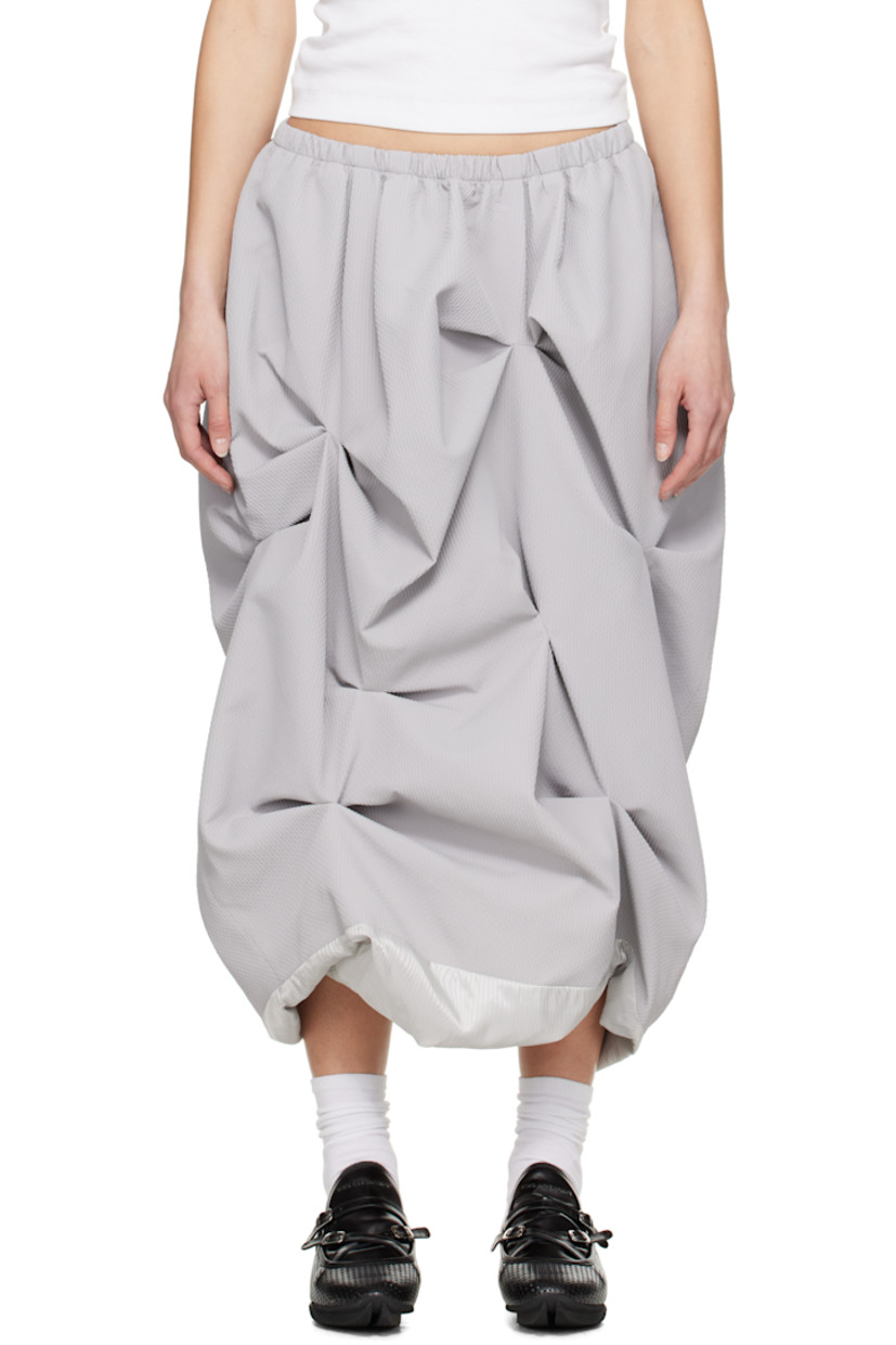 Polyester jersey midi skirt. Jacquard graphic pattern throughout. 

· Elasticized waistband
· Two-pocket styling
· Tucks at front  
· Bubble hem
· Zip closure at back
· Exposed logo-woven striped satin lining

Supplier color: Grey