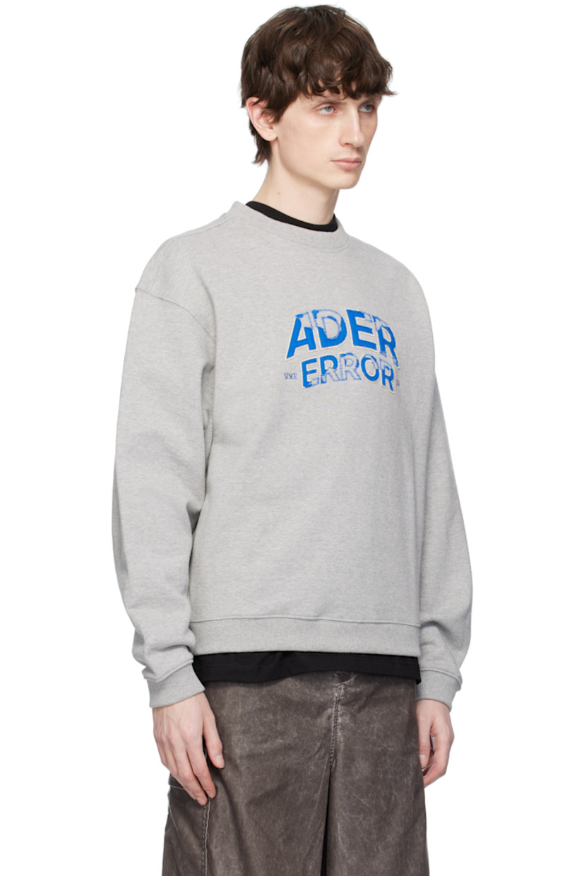 Oversized French terry sweatshirt.

· Rib-knit crewneck, hem, and cuffs
· Embroidered logo appliqués at front
· Dropped shoulders
· Logo topstitching at back

Supplier color: Grey
