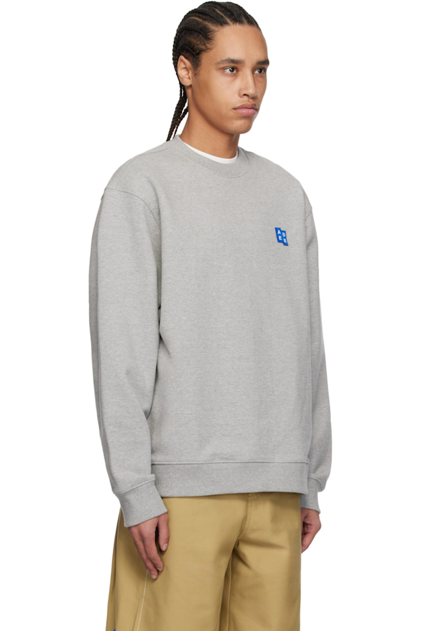 French terry sweatshirt.

· Rib-knit crewneck, hem, and cuffs
· Embroidered logo patch at chest
· Dropped shoulders
· Logo flag with topstitched logo at back

Part of the Significant collection.

Supplier color: Grey