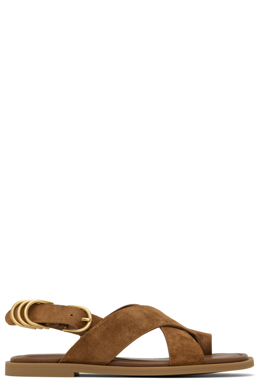 Suede flat sandals in brown. 

· LWG-certified
· Open toe
· Crisscrossing straps with integrated toe strap 
· D-rings at pin-buckle ankle strap
· OrthoLite® Lazy-Hybrid™ and OrthoLite® Recycled footbed
· Rubber sole

Supplier color: Umber suede