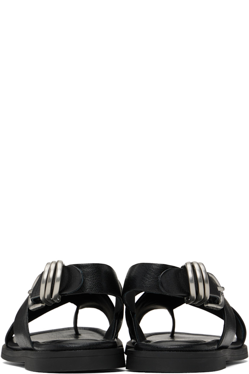 Grained goatskin flat sandals in black.

· LWG-certified
· Open toe
· Crisscrossing straps with integrated toe strap 
· D-rings at pin-buckle ankle strap
· OrthoLite® Lazy-Hybrid™ and OrthoLite® Recycled footbed
· Rubber sole

Supplier color: Black