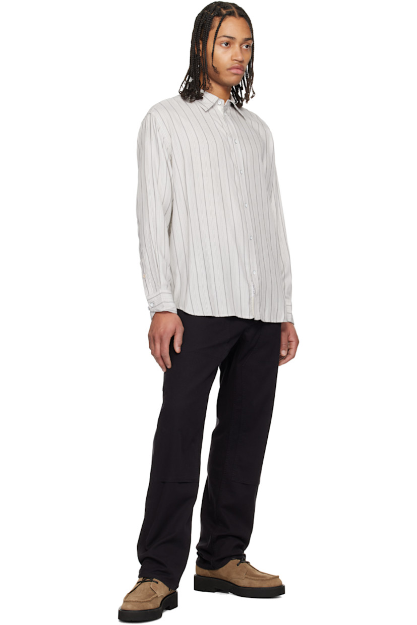 Relaxed-fit brushed modal twill shirt. Stripes throughout.

· Spread collar
· Button closure
· Logo patch at button placket
· Shirttail hem
· Pleated adjustable single-button barrel cuffs
· Locker loop at back collar

Supplier color: White stripe