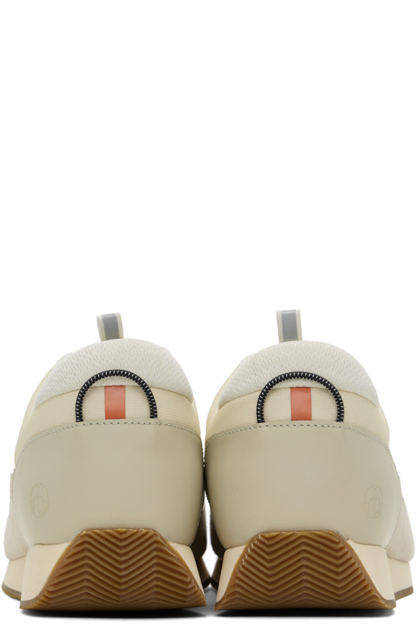Low-top paneled ripstop, suede, and buffed leather sneakers in off-white and gray.

· Reflective trim throughout
· Lace-up closure
· Pull-loop at tongue
· Padded collar
· Embossed logo at outer side
· Elasticized pull-loop at heel counter
· OrthoLite® Lazy-Hybrid™ and OrthoLite® Recycled insole
· Mesh lining
· Treaded rubber sole

Supplier color: Turtledove