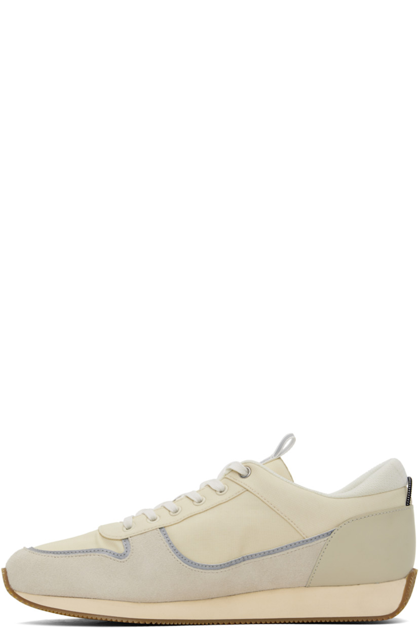 Low-top paneled ripstop, suede, and buffed leather sneakers in off-white and gray.

· Reflective trim throughout
· Lace-up closure
· Pull-loop at tongue
· Padded collar
· Embossed logo at outer side
· Elasticized pull-loop at heel counter
· OrthoLite® Lazy-Hybrid™ and OrthoLite® Recycled insole
· Mesh lining
· Treaded rubber sole

Supplier color: Turtledove