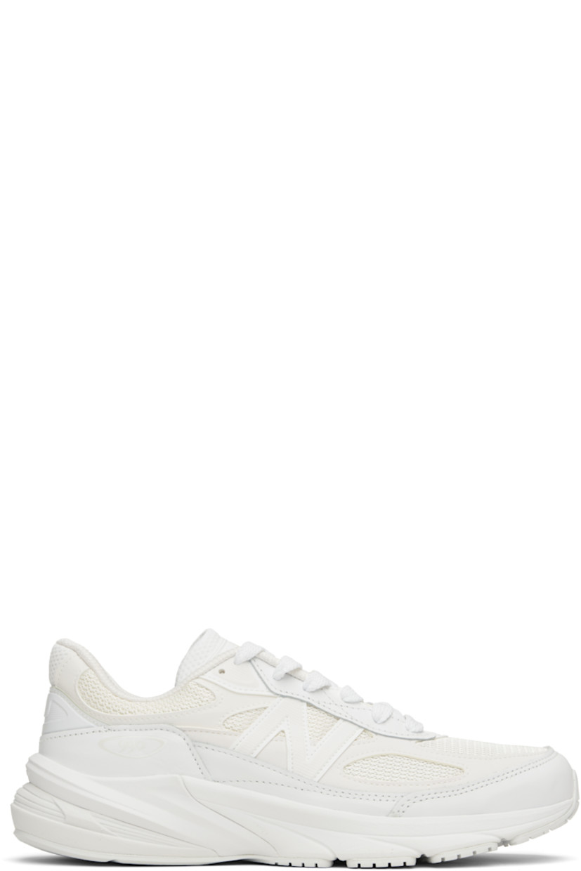 Low-top mesh and buffed leather sneakers.

· Rubberized trim throughout 
· Lace-up closure
· Logo patch at padded tongue
· Padded collar
· Logo appliqué at sides
· Text stamp at outer side
· Textured ENCAP® FuelCell rubber sole

Part of the Comme des Garçons Homme x New Balance collaboration.

Supplier color: White