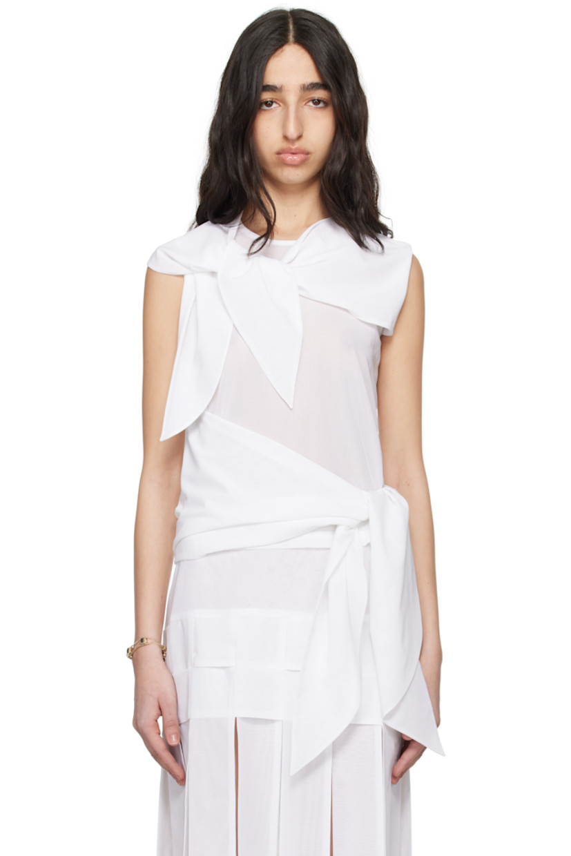 Sheer cotton voile blouse. 

· Integrated scarf-style trim at crewneck
· Self-tie overlay panel at hem 
· Button fastening at back collar
· Unlined

Supplier color: White