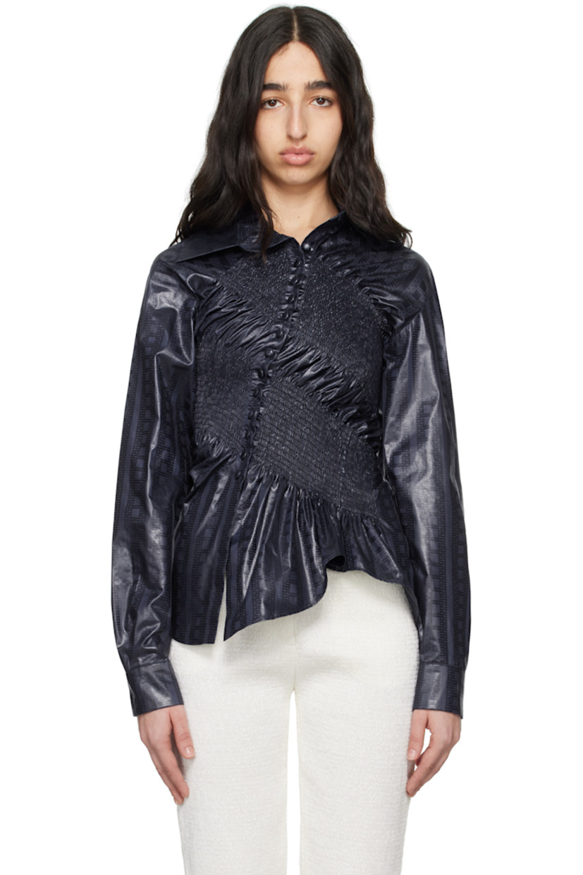 Cotton brocade shirt. Shirring and jacquard graphic pattern throughout. 

· Asymmetrical construction
· Spread collar
· Button closure
· Shirttail hem 

Supplier color: Marine