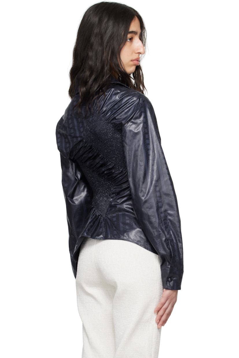 Cotton brocade shirt. Shirring and jacquard graphic pattern throughout. 

· Asymmetrical construction
· Spread collar
· Button closure
· Shirttail hem 

Supplier color: Marine