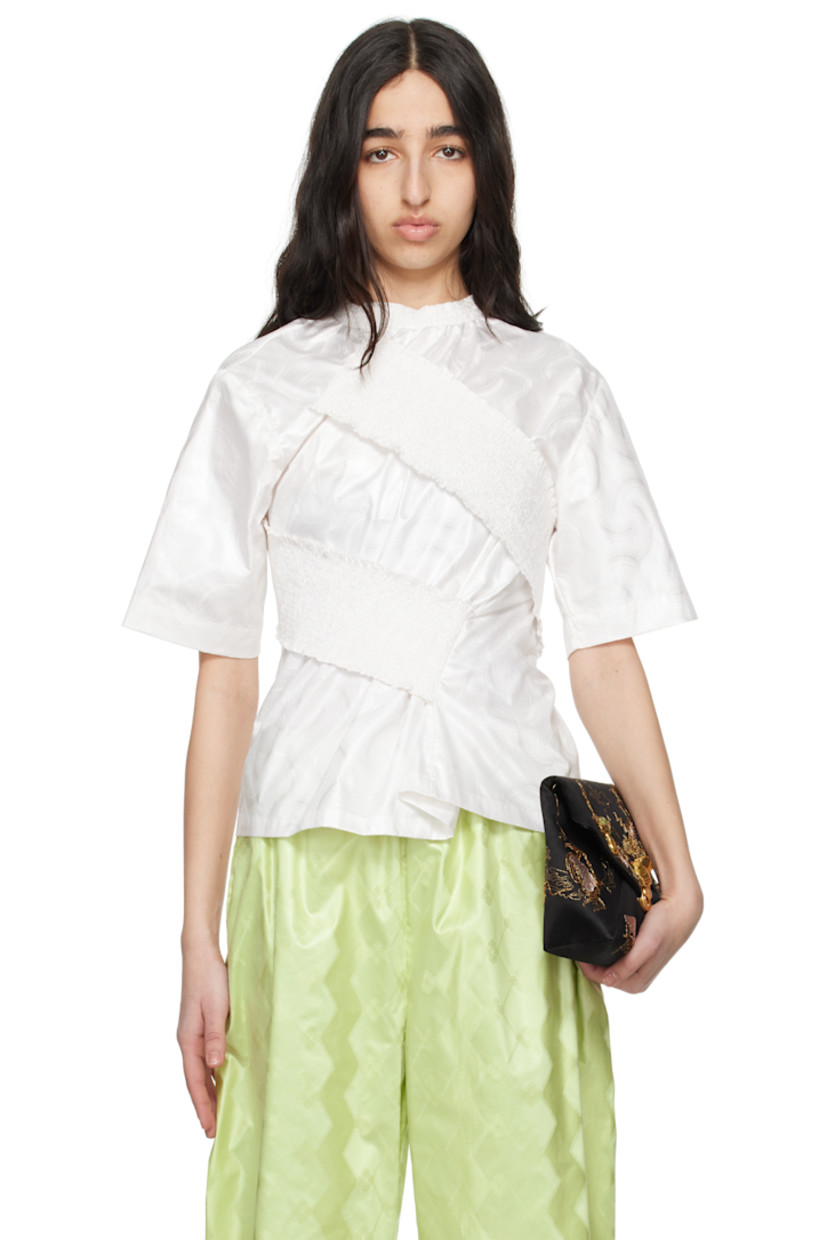 Cotton brocade T-shirt. Jacquard graphic pattern throughout. 

· Shirring at crewneck
· Wraparound overlay with shirring at front and back 
· Twisted side seams

Supplier color: Chantilly white