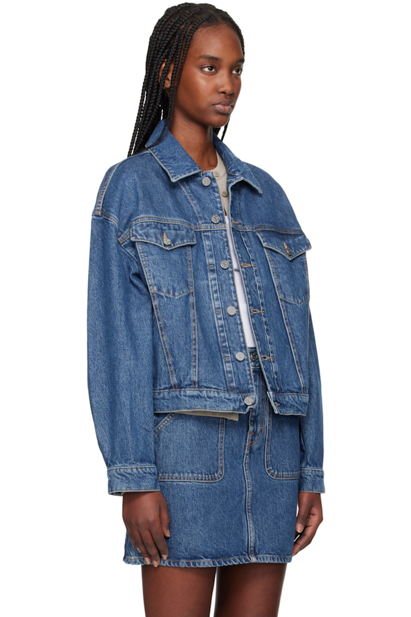 Non-stretch organic cotton- and TENCEL™ lyocell-blend denim jacket. Fading throughout.

· Loose-fit
· Spread collar
· Button closure
· Flap and welt pockets
· Dropped shoulders
· Pleated single-button barrel cuffs
· Adjustable button tabs at back hem
· Logo-engraved silver-tone hardware
· Contrast stitching in tan

Supplier color: Washed mid blue