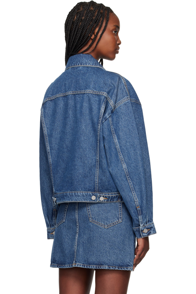 Non-stretch organic cotton- and TENCEL™ lyocell-blend denim jacket. Fading throughout.

· Loose-fit
· Spread collar
· Button closure
· Flap and welt pockets
· Dropped shoulders
· Pleated single-button barrel cuffs
· Adjustable button tabs at back hem
· Logo-engraved silver-tone hardware
· Contrast stitching in tan

Supplier color: Washed mid blue