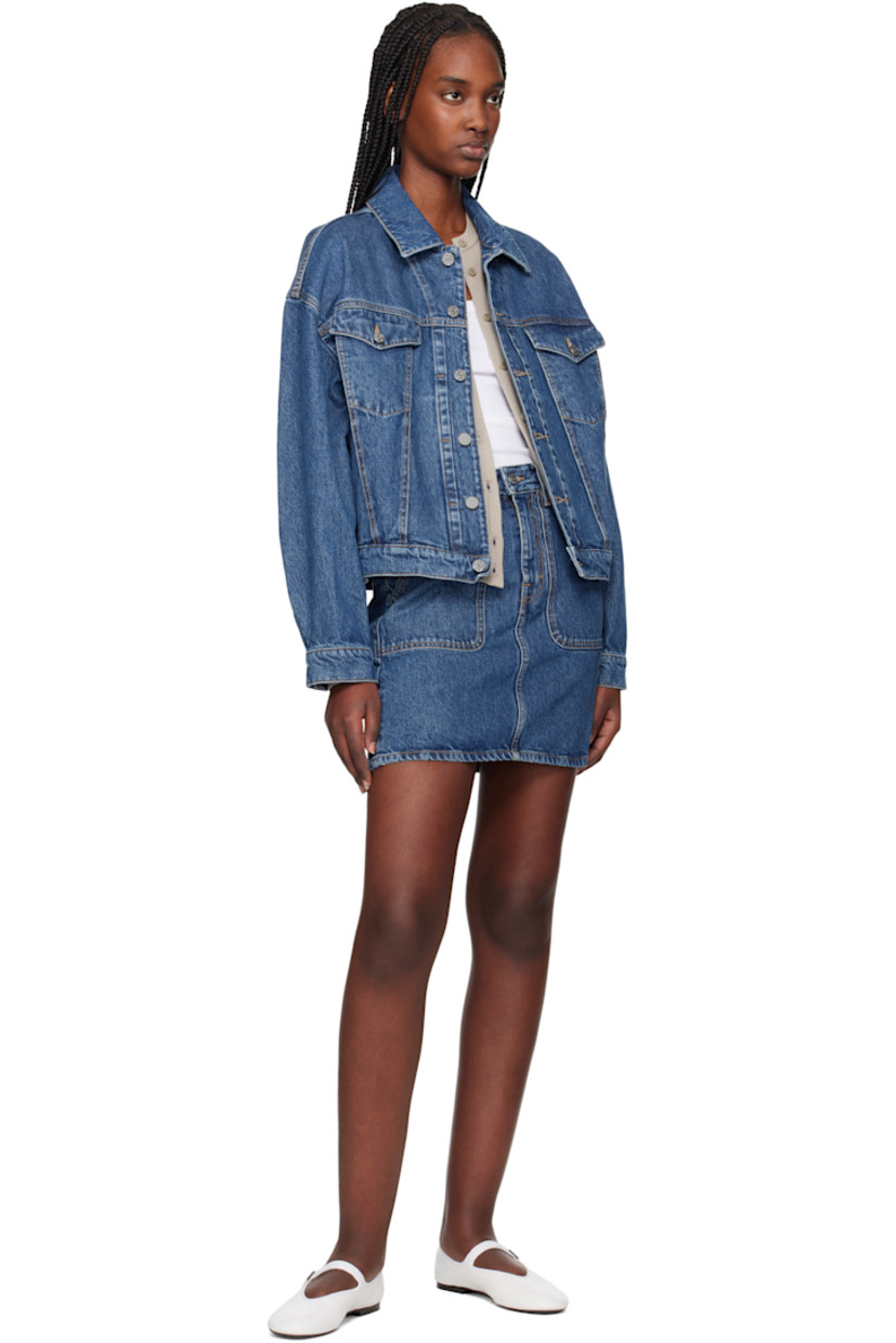 Non-stretch organic cotton- and TENCEL™ lyocell-blend denim jacket. Fading throughout.

· Loose-fit
· Spread collar
· Button closure
· Flap and welt pockets
· Dropped shoulders
· Pleated single-button barrel cuffs
· Adjustable button tabs at back hem
· Logo-engraved silver-tone hardware
· Contrast stitching in tan

Supplier color: Washed mid blue