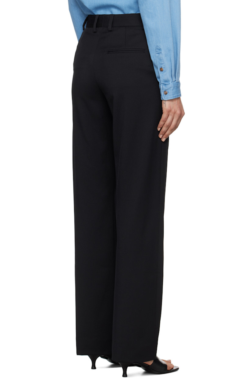 Bootcut stretch polyester- and wool-blend twill trousers.

· High-rise
· Belt loops
· Three-pocket styling
· Zip-fly
· Creased legs

Supplier color: Black