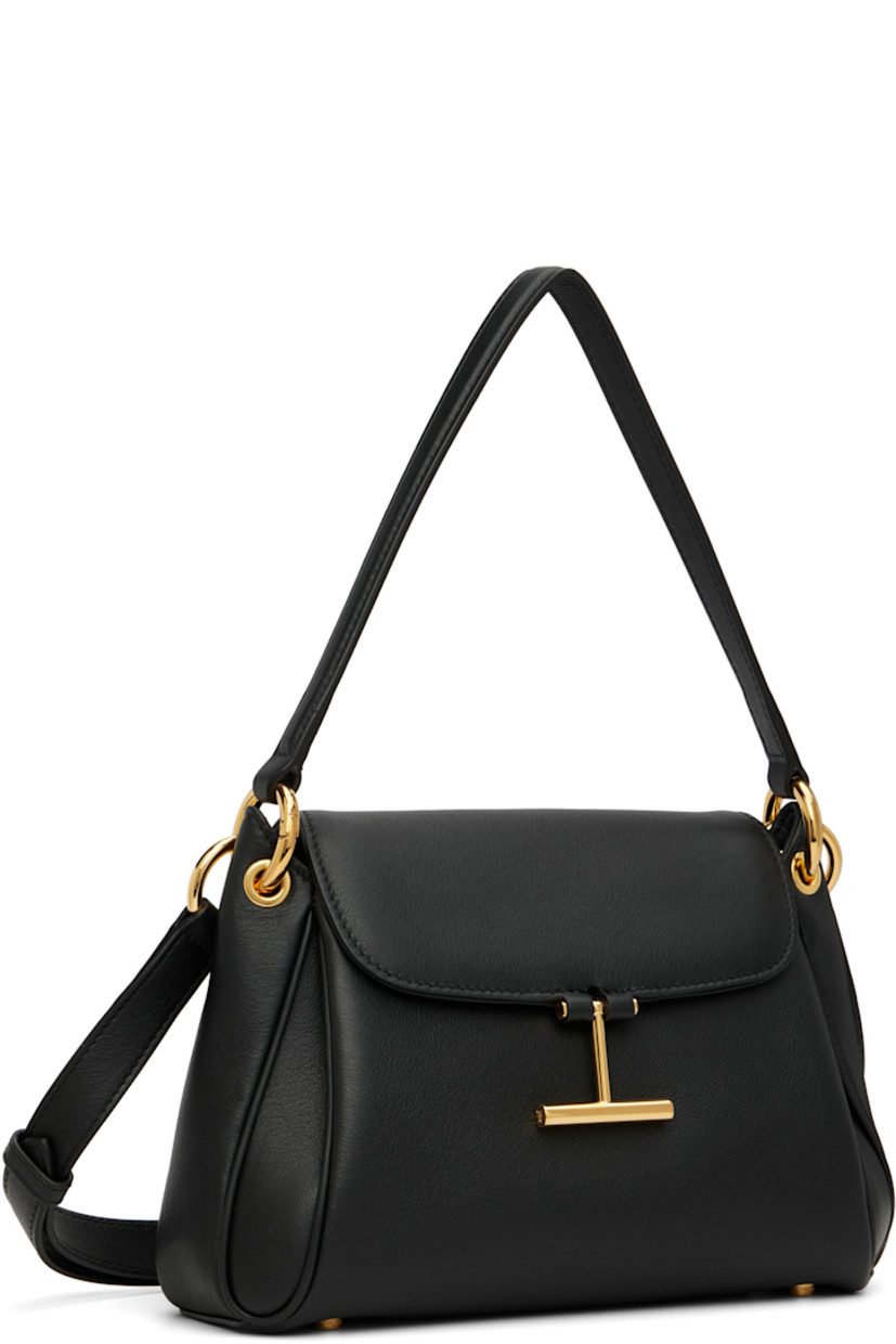 Grained calfskin shoulder bag.

· Detachable carry handle
· Adjustable and detachable crossbody strap
· Patch pocket at back face
· Bumper studs at base
· Logo hardware at magnetic flap
· Patch pocket at interior
· Faux-suede lining
· Logo-engraved gold-tone hardware
· H6.5" x W9" x D3"

Supplier color: Black