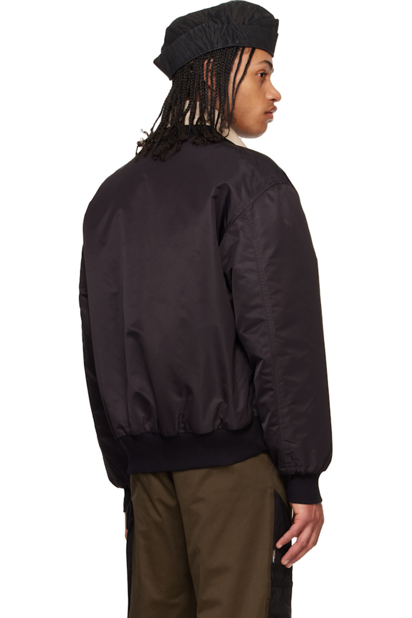 Nylon taffeta bomber jacket.

· Partially rib-knit V-neck
· Zip closure with press-stud placket
· Logo embroidered grosgrain trim at chest
· Flap pockets
· Rib-knit hem and cuffs
· Welt pocket at interior
· Full satin lining

Supplier color: Black