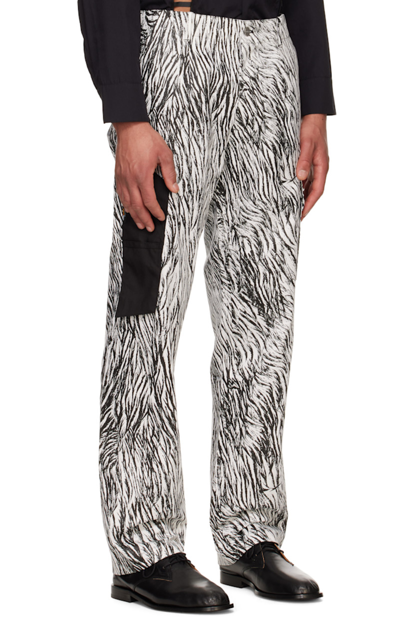 Cotton twill cargo pants. Camouflage pattern printed throughout.

· Belt loops
· Three-pocket styling
· Zip fly
· Pleats at front
· Cordura® nylon canvas patch pockets at outseam
· Cargo pocket at outseam
· Logo-engraved silver-tone hardware

Supplier color: Infared camouflage