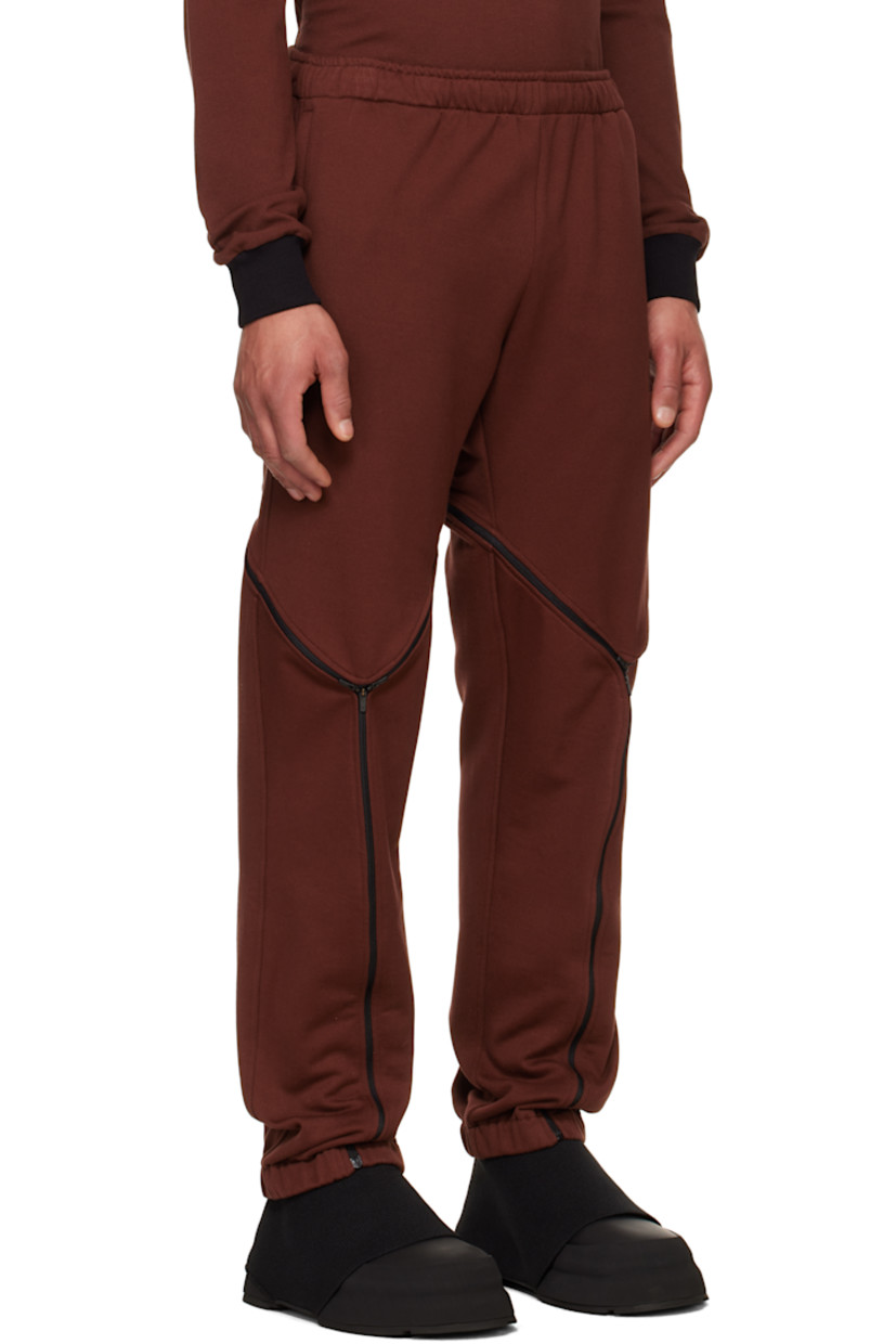 French terry sweatpants.

· Concealed drawstring at elasticized waistband
· Two-pocket styling
· Logo graphic printed at front
· Zip mesh expansion panel at legs
· Elasticized cuffs

Supplier color: Port/Black