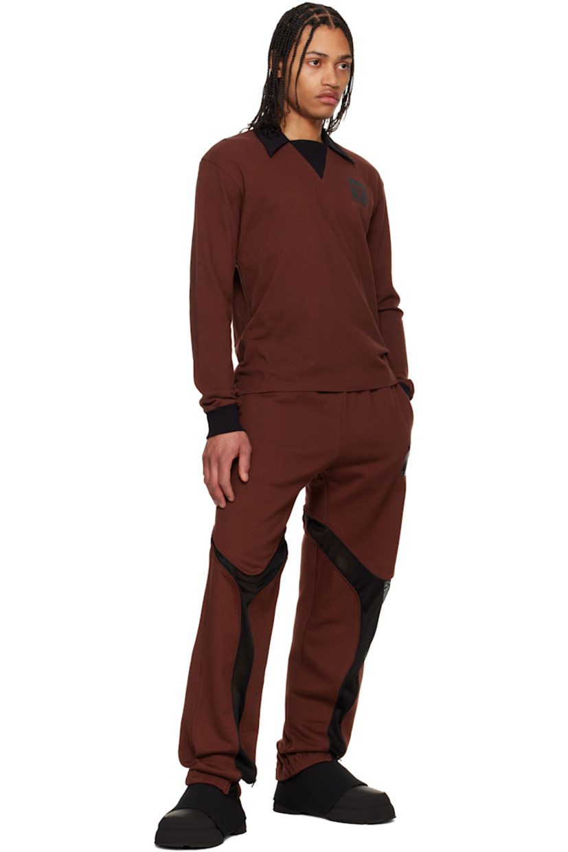 French terry sweatpants.

· Concealed drawstring at elasticized waistband
· Two-pocket styling
· Logo graphic printed at front
· Zip mesh expansion panel at legs
· Elasticized cuffs

Supplier color: Port/Black