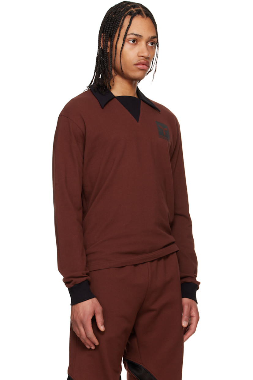 Cotton piqué polo.

· Rib-knit spread collar, placket, and cuffs
· Logo graphic printed at chest

Supplier color: Port