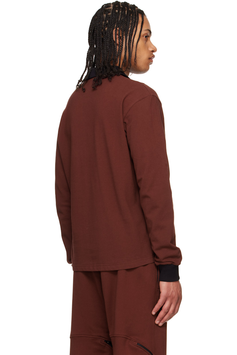Cotton piqué polo.

· Rib-knit spread collar, placket, and cuffs
· Logo graphic printed at chest

Supplier color: Port