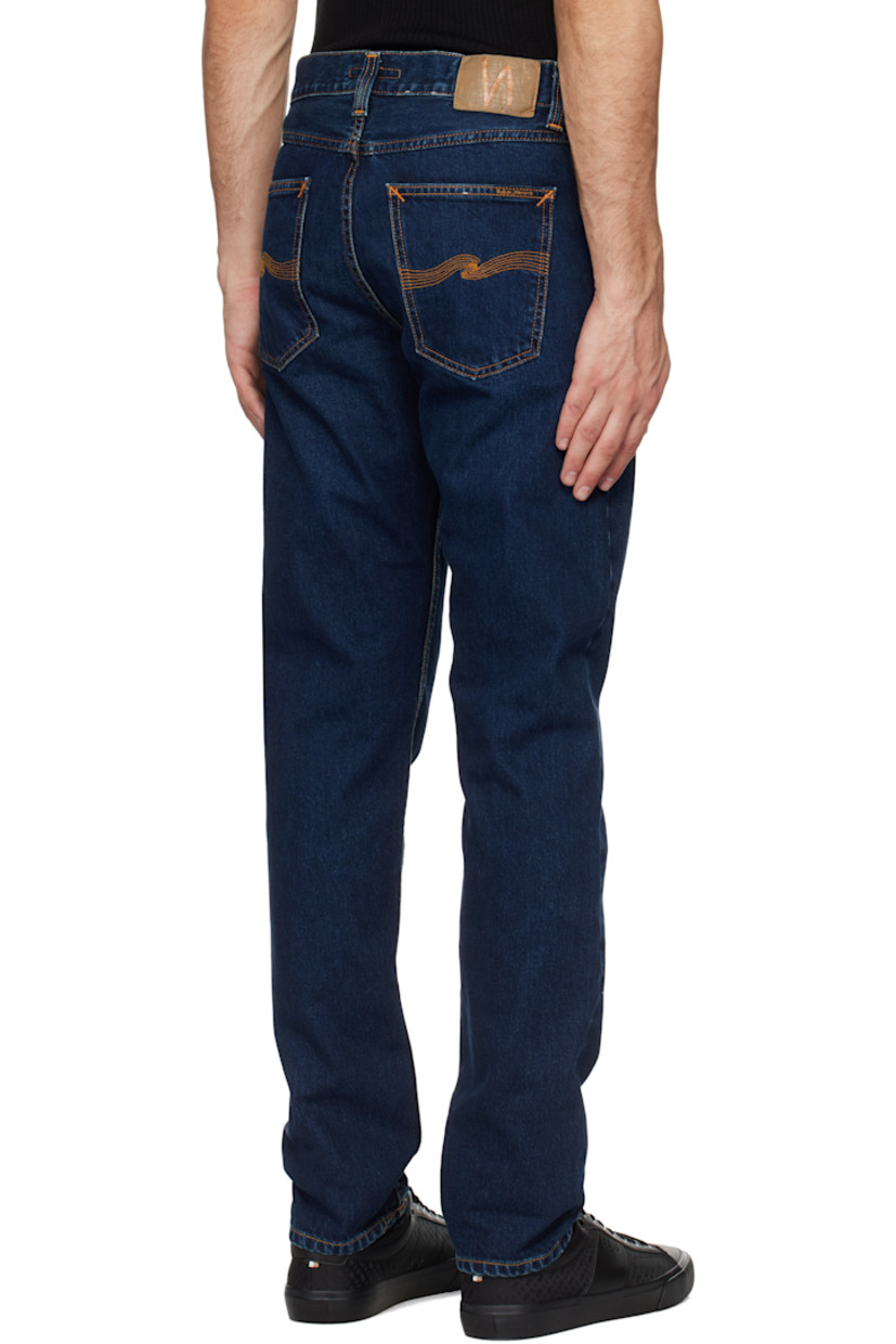 Slim-fit and tapered 13.3 oz non-stretch organic cotton denim jeans. Fading and whiskering throughout.

· Mid-rise
· Belt loops
· Five-pocket styling
· Button fly
· Jacron logo patch at back waistband
· Logo patch at back pocket
· Logo-engraved brass-tone hardware
· Contrast stitching in orange

Supplier color: Indigo nights