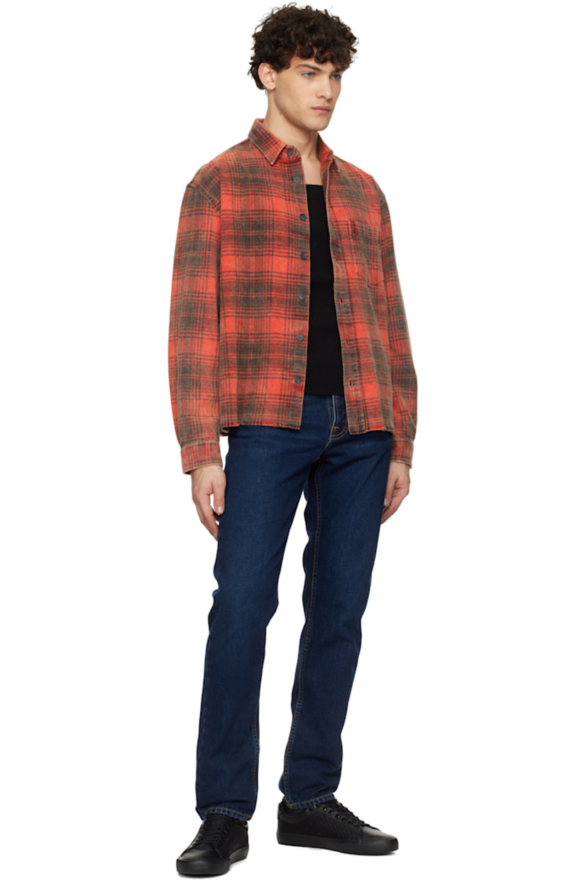 Slim-fit and tapered 13.3 oz non-stretch organic cotton denim jeans. Fading and whiskering throughout.

· Mid-rise
· Belt loops
· Five-pocket styling
· Button fly
· Jacron logo patch at back waistband
· Logo patch at back pocket
· Logo-engraved brass-tone hardware
· Contrast stitching in orange

Supplier color: Indigo nights