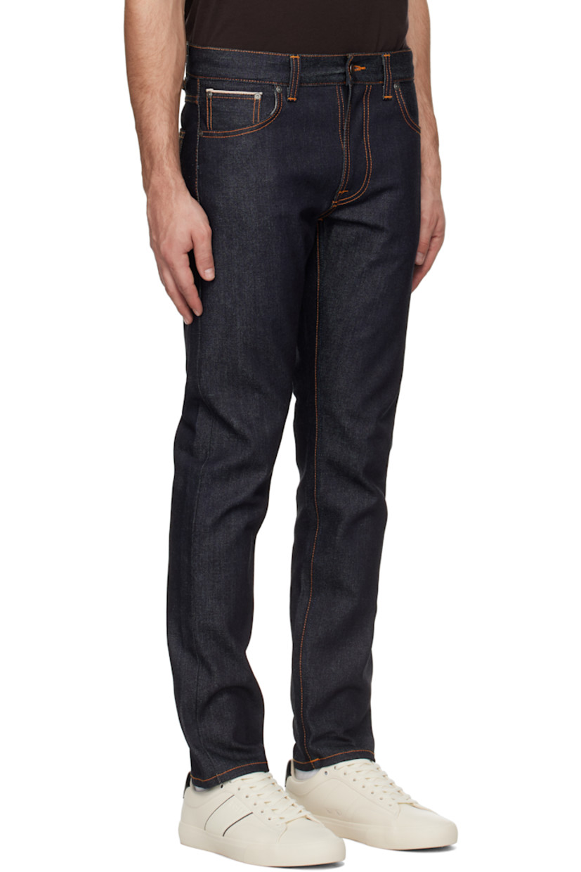 13 oz stretch organic cotton selvedge denim jeans. 

· Slim-fit and tapered
· Mid-rise
· Belt loops
· Five-pocket styling
· Zip-fly
· Jacron logo patch at back waistband
· Logo patch at back pocket
· Logo-engraved antiqued silver-tone hardware
· Contrast stitching in orange

Supplier color: Dry Japan selvage