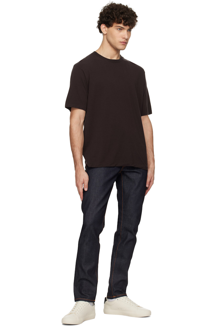 13 oz stretch organic cotton selvedge denim jeans. 

· Slim-fit and tapered
· Mid-rise
· Belt loops
· Five-pocket styling
· Zip-fly
· Jacron logo patch at back waistband
· Logo patch at back pocket
· Logo-engraved antiqued silver-tone hardware
· Contrast stitching in orange

Supplier color: Dry Japan selvage
