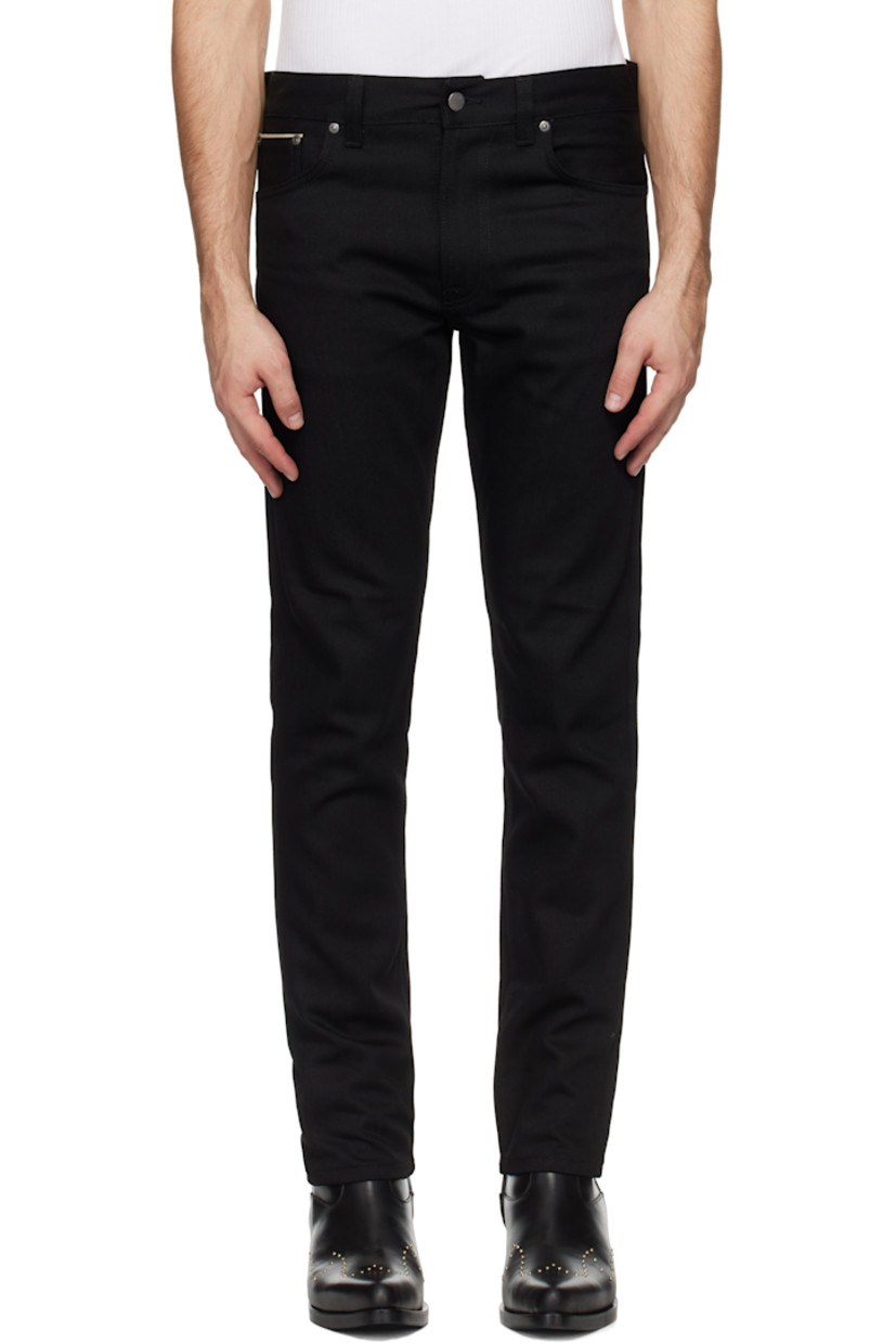 12.75 oz stretch organic cotton selvedge denim jeans.

· Slim-fit and tapered
· Mid-rise
· Belt loops
· Five-pocket styling
· Zip-fly
· Leather logo patch at back waistband
· Logo patch at back pocket
· Logo-engraved antiqued silver-tone hardware

Supplier color: Dry black selvage