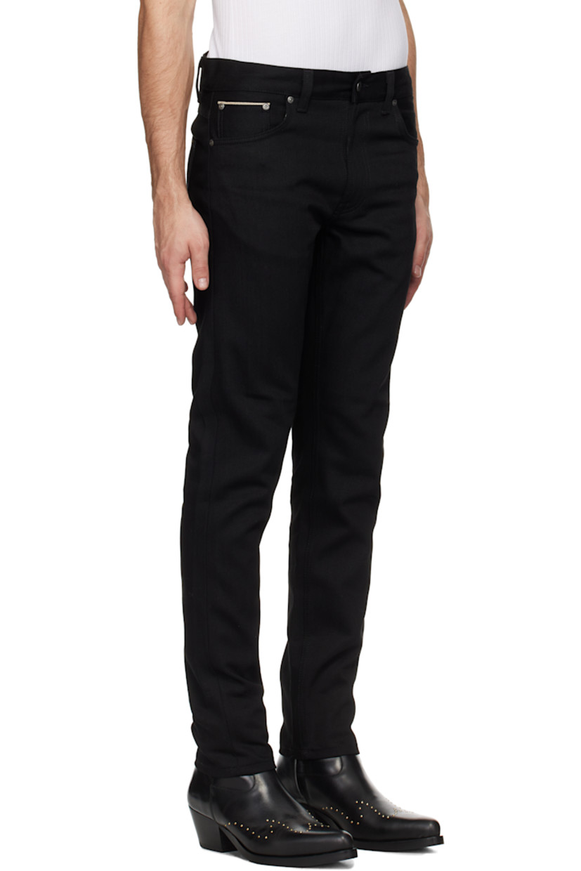 12.75 oz stretch organic cotton selvedge denim jeans.

· Slim-fit and tapered
· Mid-rise
· Belt loops
· Five-pocket styling
· Zip-fly
· Leather logo patch at back waistband
· Logo patch at back pocket
· Logo-engraved antiqued silver-tone hardware

Supplier color: Dry black selvage