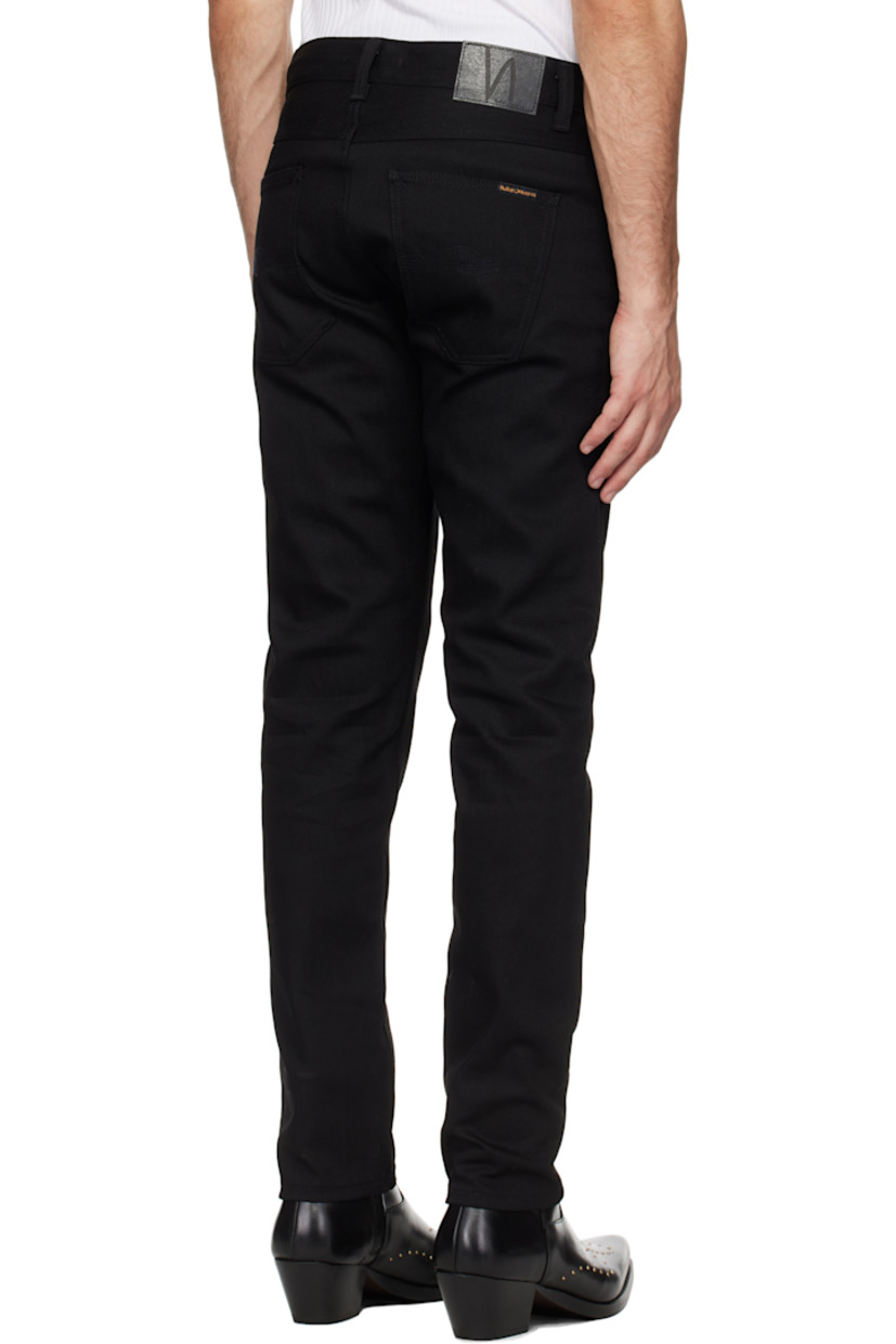 12.75 oz stretch organic cotton selvedge denim jeans.

· Slim-fit and tapered
· Mid-rise
· Belt loops
· Five-pocket styling
· Zip-fly
· Leather logo patch at back waistband
· Logo patch at back pocket
· Logo-engraved antiqued silver-tone hardware

Supplier color: Dry black selvage