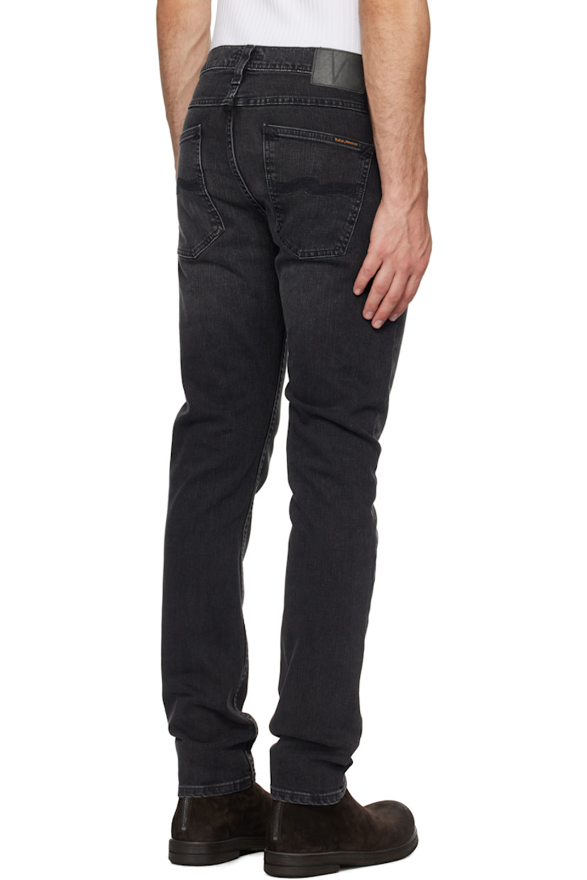 Slim-fit and tapered 11.75 oz stretch denim jeans. Fading and whiskering throughout.

· Mid-rise
· Belt loops
· Five-pocket styling
· Button-fly
· Jacron logo patch at back waistband
· Logo patch at back pocket
· Logo-engraved antiqued silver-tone hardware

Supplier color: Black eyes