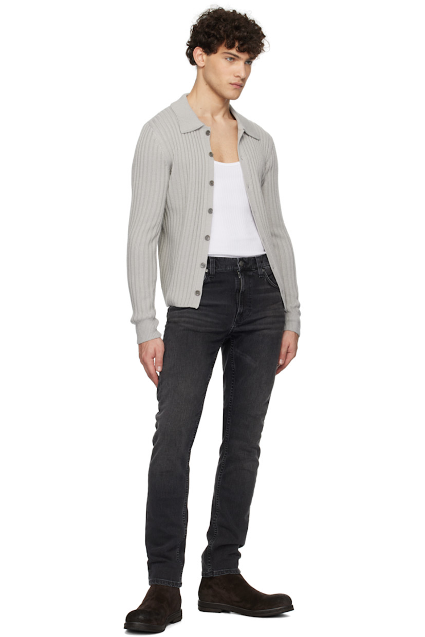 Slim-fit and tapered 11.75 oz stretch denim jeans. Fading and whiskering throughout.

· Mid-rise
· Belt loops
· Five-pocket styling
· Button-fly
· Jacron logo patch at back waistband
· Logo patch at back pocket
· Logo-engraved antiqued silver-tone hardware

Supplier color: Black eyes
