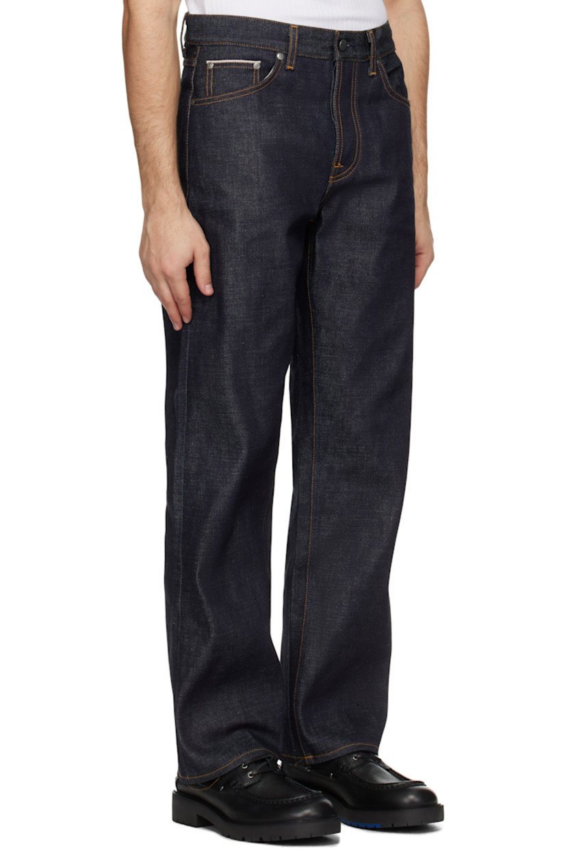 14.2 oz non-stretch organic cotton selvedge denim jeans.

· Loose-fit and wide-leg
· High-rise
· Belt loops
· Five-pocket styling
· Button fly
· Jacron logo patch at back waistband
· Logo patch at back pocket
· Topstitching at back pockets
· Logo-engraved antiqued silver-tone hardware
· Contrast stitching in tan

Supplier color: Ace selvage