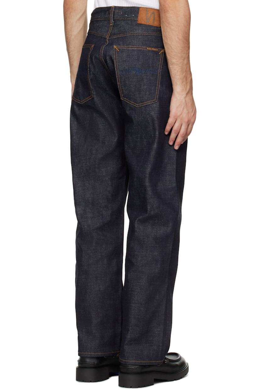 14.2 oz non-stretch organic cotton selvedge denim jeans.

· Loose-fit and wide-leg
· High-rise
· Belt loops
· Five-pocket styling
· Button fly
· Jacron logo patch at back waistband
· Logo patch at back pocket
· Topstitching at back pockets
· Logo-engraved antiqued silver-tone hardware
· Contrast stitching in tan

Supplier color: Ace selvage