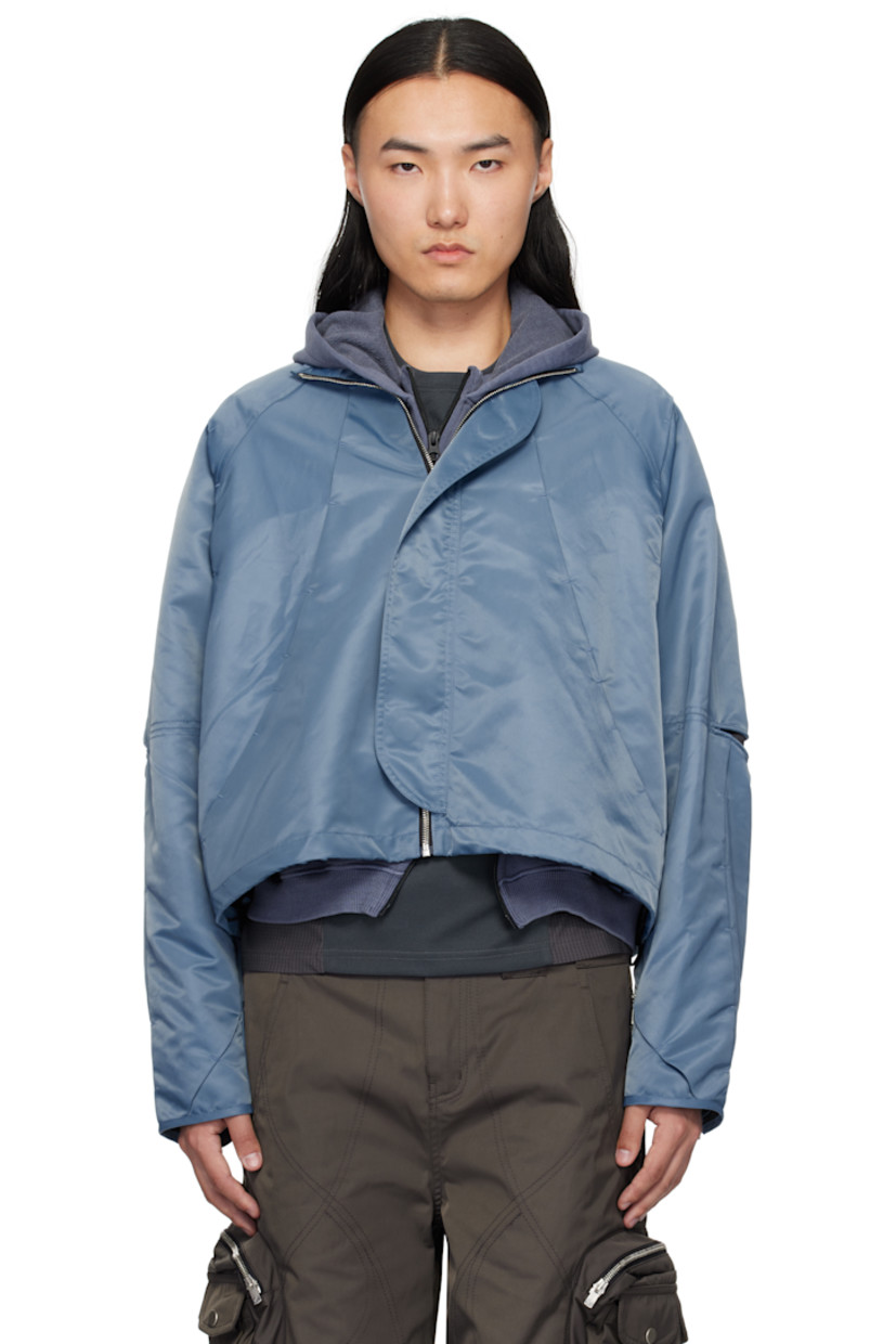 Nylon twill jacket. Tucks throughout.

· Pleats and self-tie strap at detachable hood
· Funnel neck
· Zip closure
· Bungee-style drawstring at hem
· Underwire at elbows
· Zip expansion panel at cuffs
· Full cupro satin lining

Supplier color: Light blue