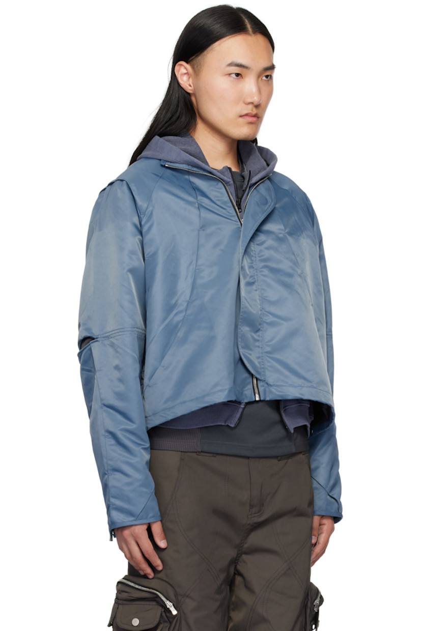 Nylon twill jacket. Tucks throughout.

· Pleats and self-tie strap at detachable hood
· Funnel neck
· Zip closure
· Bungee-style drawstring at hem
· Underwire at elbows
· Zip expansion panel at cuffs
· Full cupro satin lining

Supplier color: Light blue