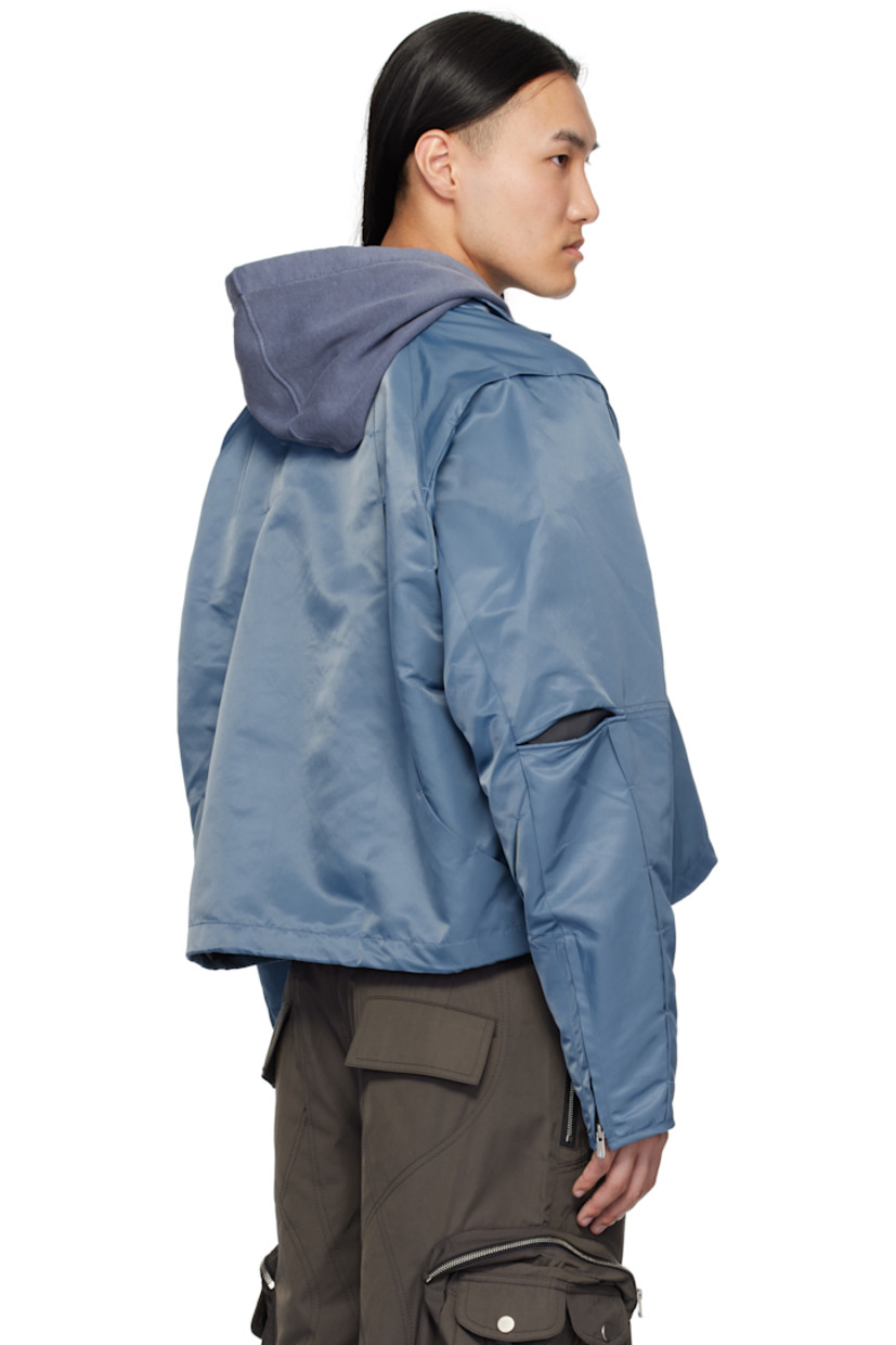 Nylon twill jacket. Tucks throughout.

· Pleats and self-tie strap at detachable hood
· Funnel neck
· Zip closure
· Bungee-style drawstring at hem
· Underwire at elbows
· Zip expansion panel at cuffs
· Full cupro satin lining

Supplier color: Light blue