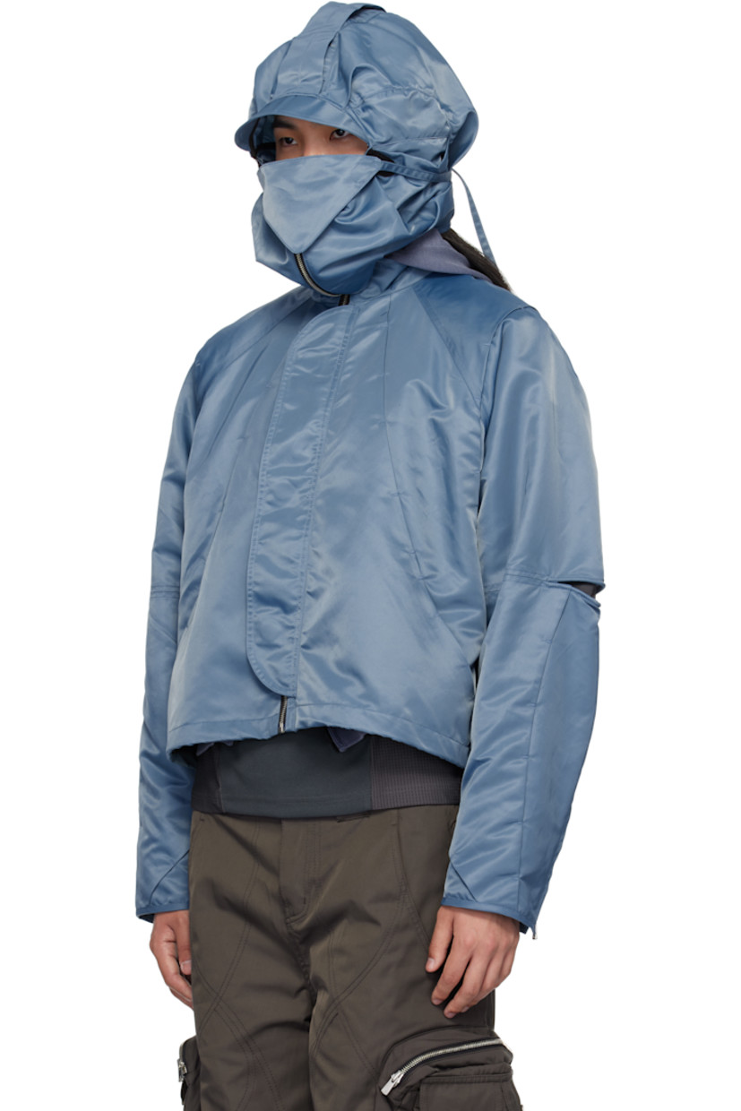 Nylon twill jacket. Tucks throughout.

· Pleats and self-tie strap at detachable hood
· Funnel neck
· Zip closure
· Bungee-style drawstring at hem
· Underwire at elbows
· Zip expansion panel at cuffs
· Full cupro satin lining

Supplier color: Light blue