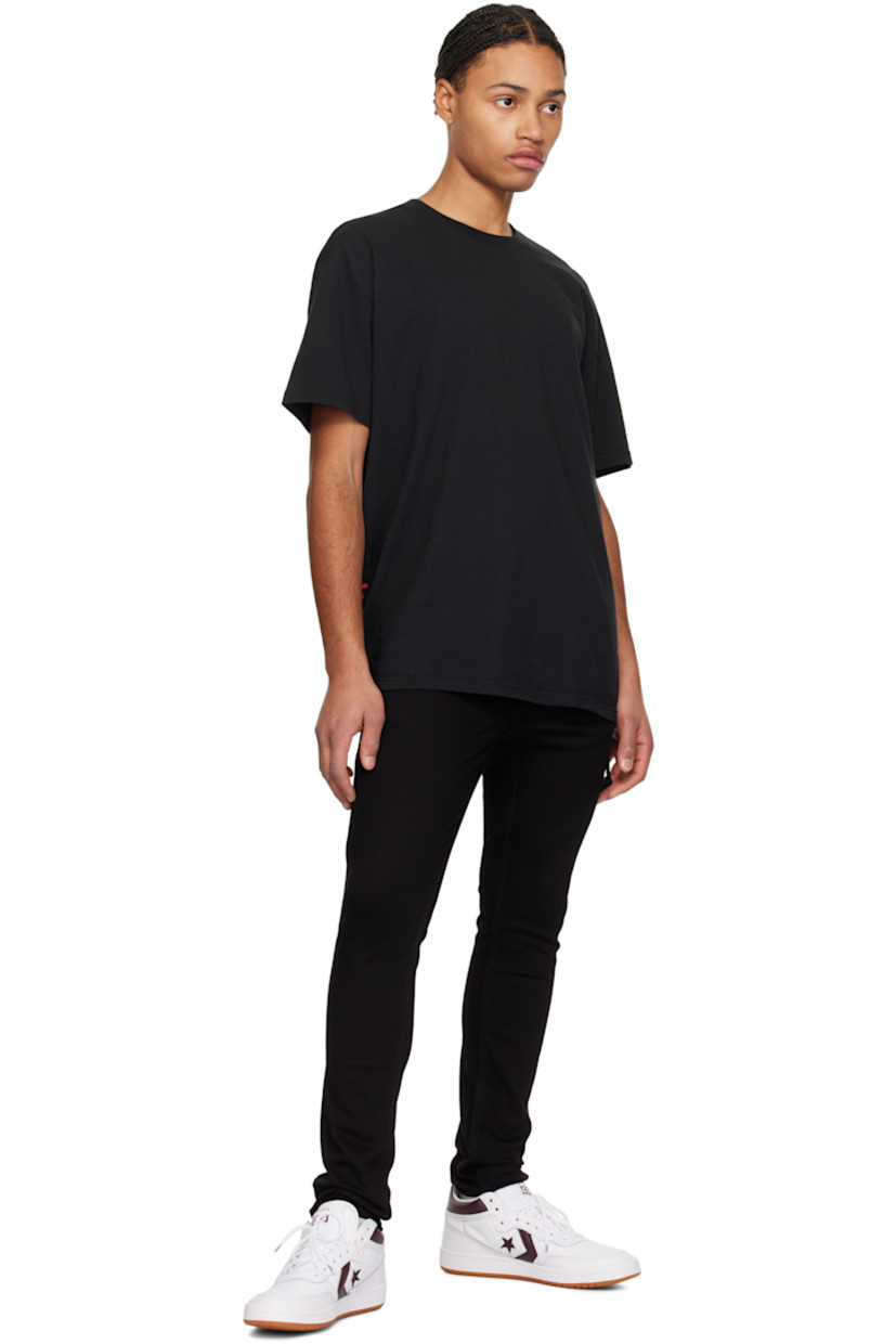 Slim-fit heavyweight stretch denim jeans.

· Mid-rise
· Belt loops
· Five-pocket styling
· Button fly
· Logo graphic embroidered at back waist
· Detachable logo flag at back pocket
· Logo printed at back leg
· Logo-engraved black hardware

Supplier color: Black