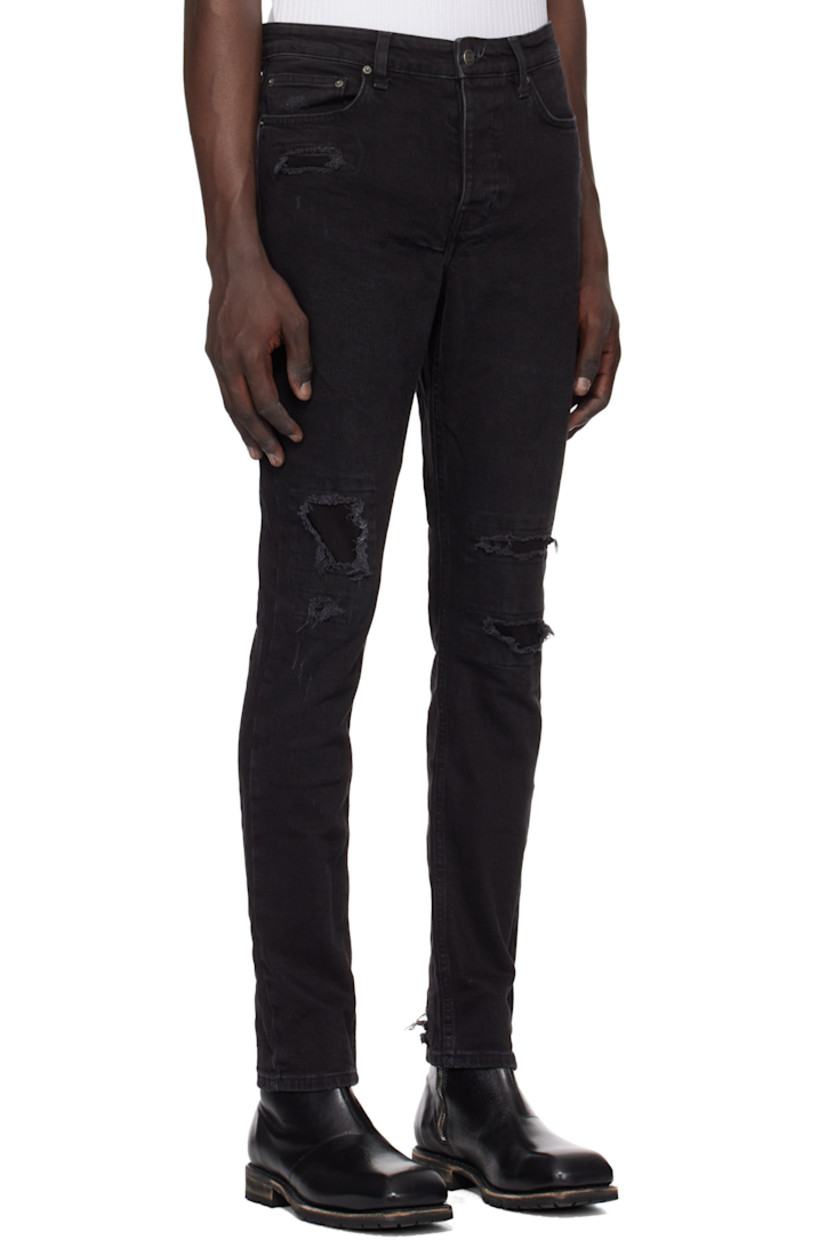 Slim-fit heavyweight stretch denim jeans. Fading and distressing throughout.

· Mid-rise
· Belt loops
· Five-pocket styling
· Button fly
· Logo graphic embroidered at back waistband
· Detachable logo flag at back pocket
· Logo printed at back leg
· Logo-engraved oxidized silver-tone hardware

Supplier color: Black