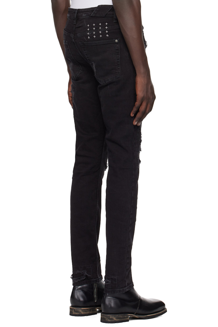 Slim-fit heavyweight stretch denim jeans. Fading and distressing throughout.

· Mid-rise
· Belt loops
· Five-pocket styling
· Button fly
· Logo graphic embroidered at back waistband
· Detachable logo flag at back pocket
· Logo printed at back leg
· Logo-engraved oxidized silver-tone hardware

Supplier color: Black