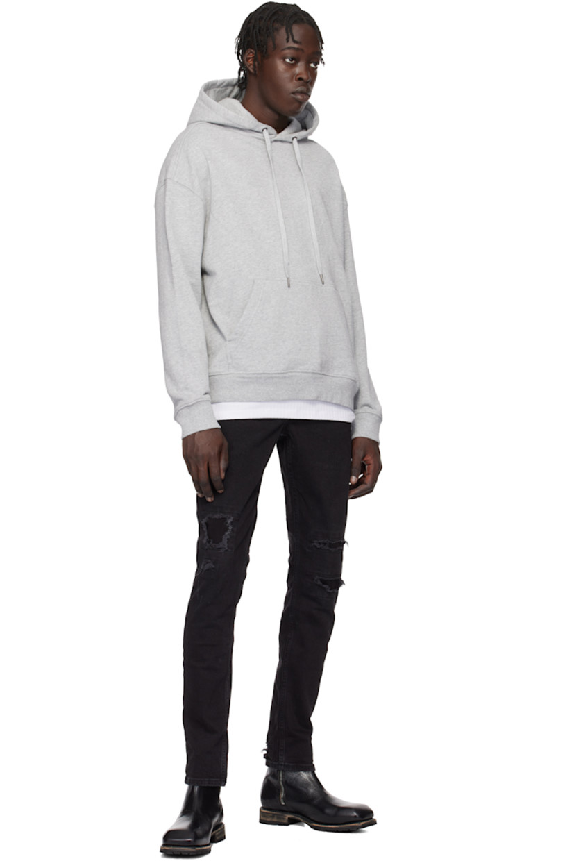 Slim-fit heavyweight stretch denim jeans. Fading and distressing throughout.

· Mid-rise
· Belt loops
· Five-pocket styling
· Button fly
· Logo graphic embroidered at back waistband
· Detachable logo flag at back pocket
· Logo printed at back leg
· Logo-engraved oxidized silver-tone hardware

Supplier color: Black
