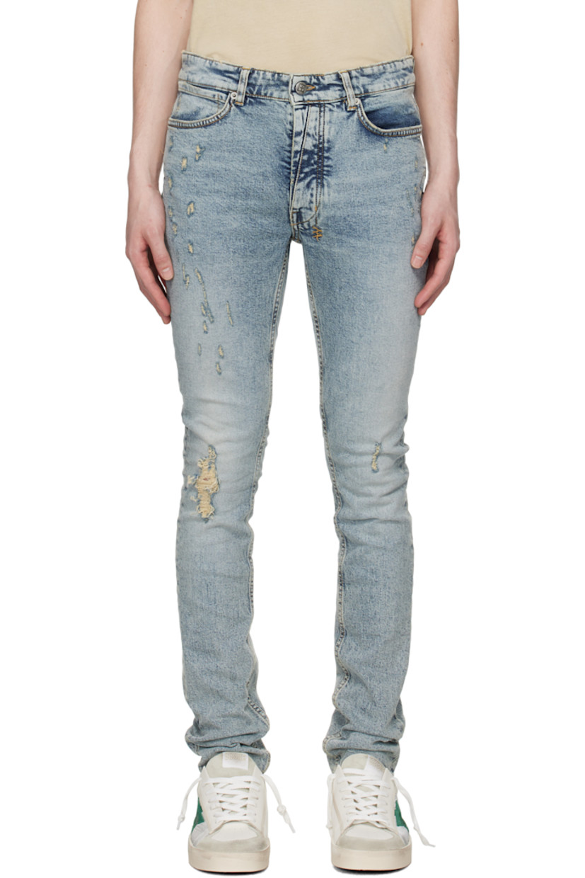 Skinny-fit stretch denim jeans. Fading, whiskering, and subtle distressing throughout.

· Belt loops
· Five-pocket styling
· Button fly
· Logo graphics embroidered at back waist and leg
· Logo patch at back pocket
· Logo-engraved gunmetal-tone hardware
· Contrast stitching in tan

Supplier color: Rogue blue scatter
