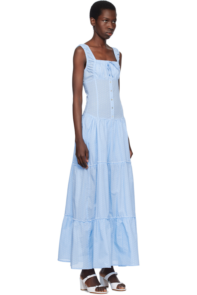 Plain-woven cotton dress. Ruffled trim and polka-dot pattern printed throughout.

· Drawstring at elasticized square neck
· Gathering at chest and waist
· Mock button closure
· Tiered skirt 
· Elasticized shoulder straps
· Shirring at back
· Partially lined

Supplier color: Raindrop